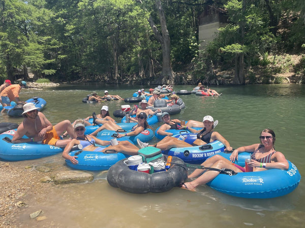 Friends floating the Guadalupe River on tubes with Rockin' R in New Braunfels